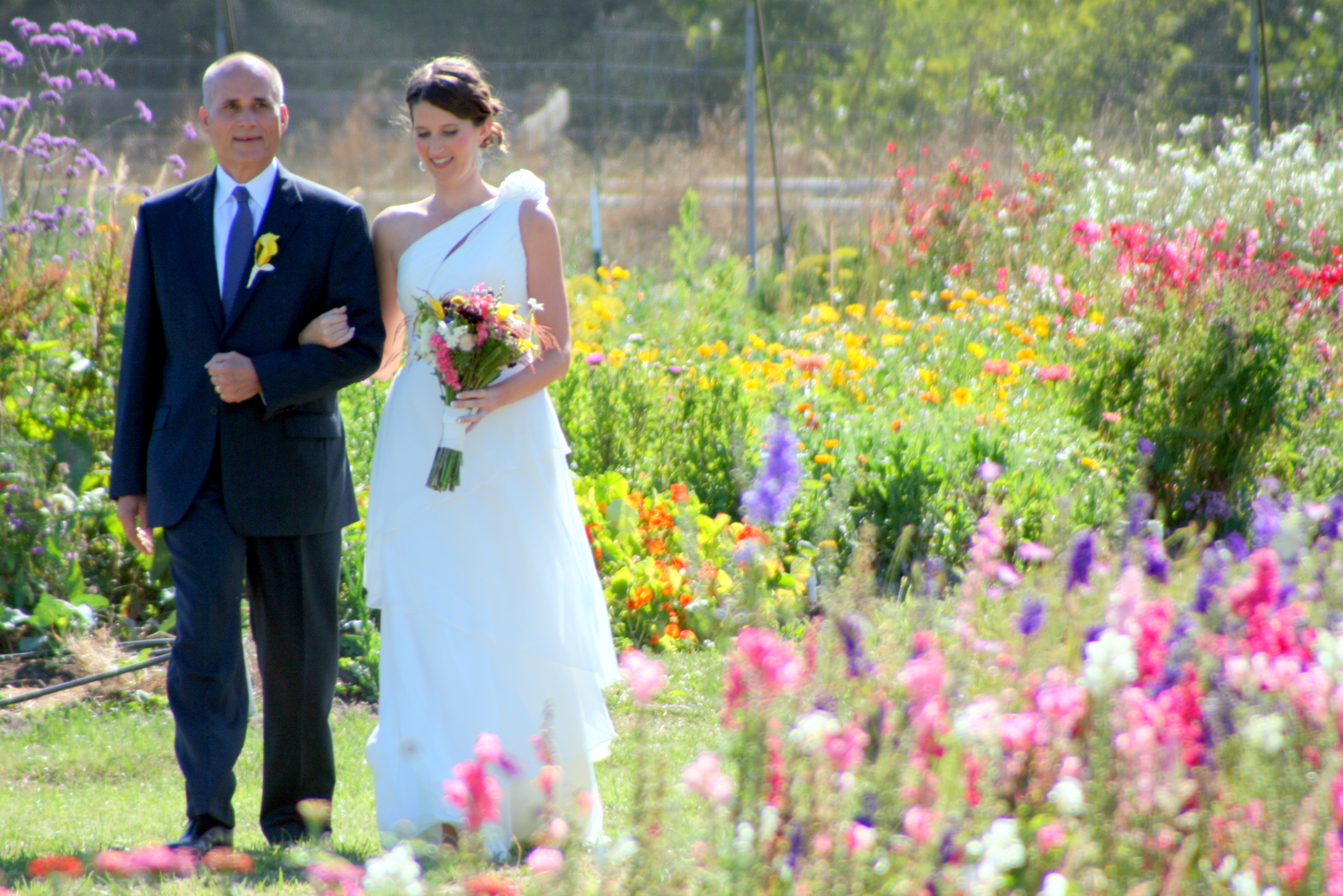 Beth and father come down the aisle