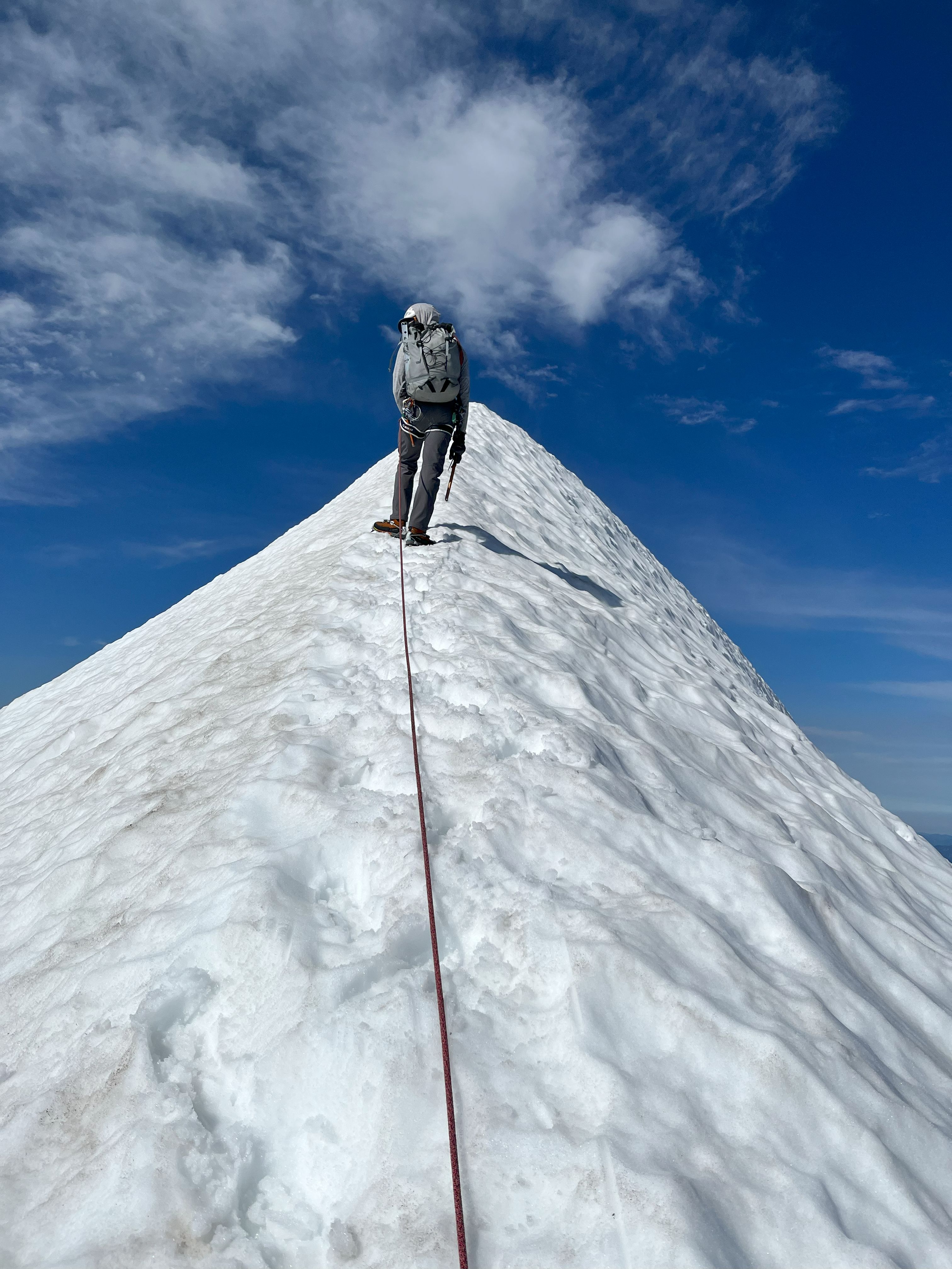 Knife-ridge snow path to summit